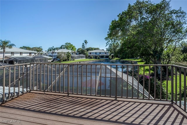 wooden terrace with a water view