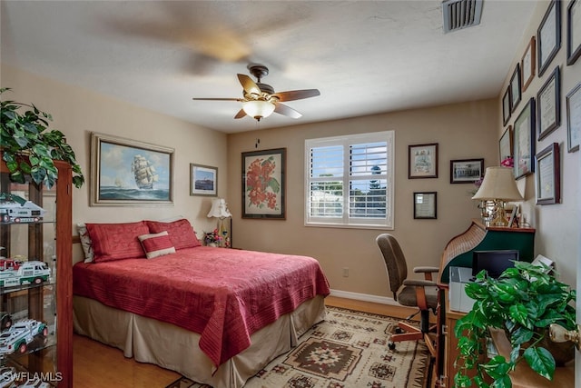 bedroom with light wood-type flooring and ceiling fan