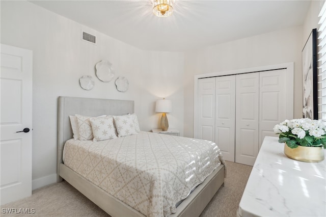 carpeted bedroom featuring a closet