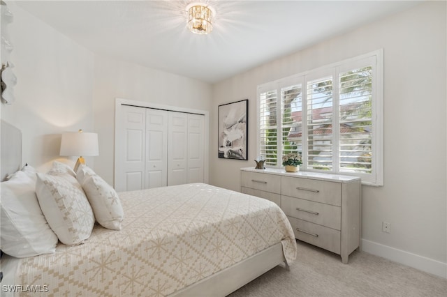 carpeted bedroom featuring a closet