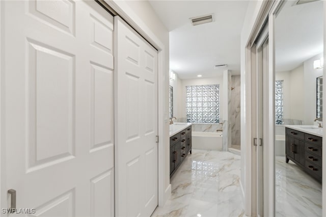 bathroom with vanity and independent shower and bath