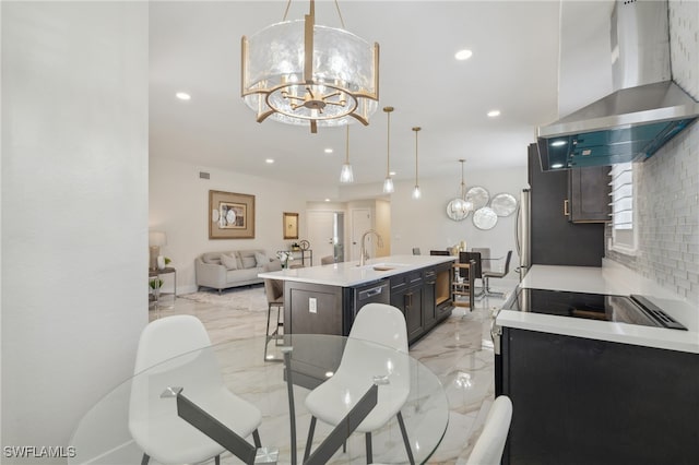 dining space with sink and an inviting chandelier