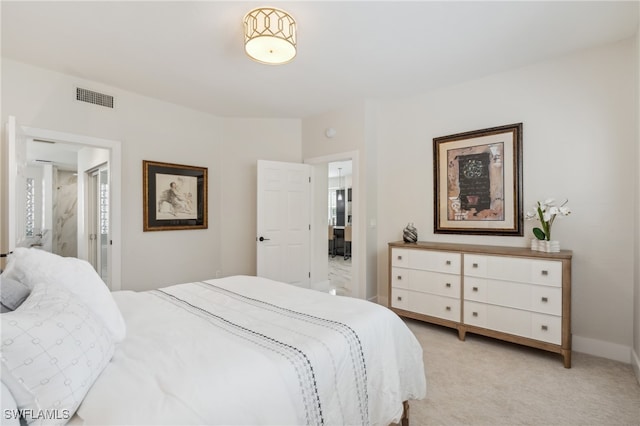 bedroom with light colored carpet