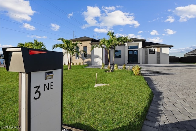 view of front of home with a front yard