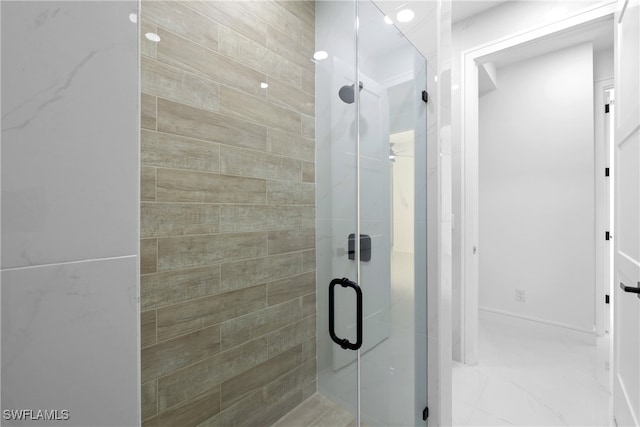 bathroom featuring an enclosed shower