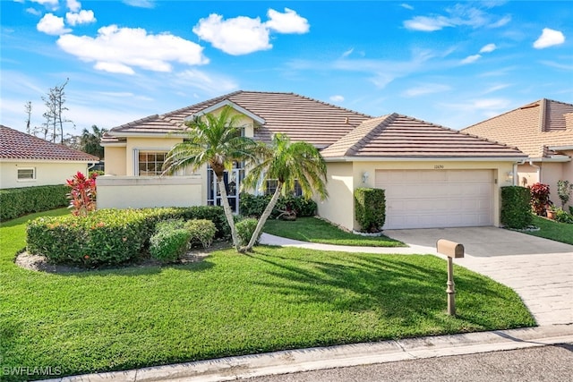 view of front of property featuring a garage and a front yard