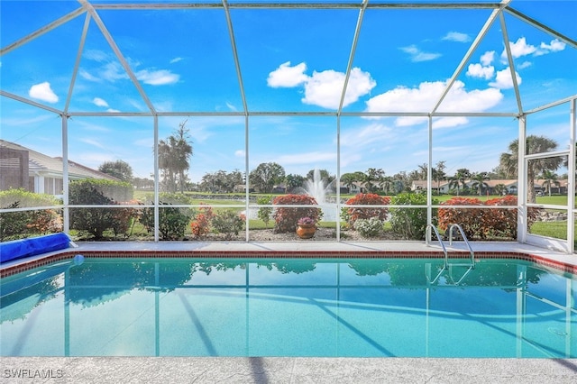 view of pool featuring a lanai