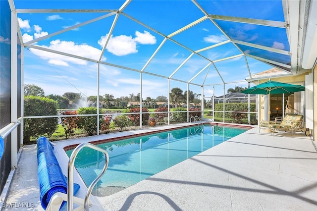 view of pool featuring a patio area and a lanai