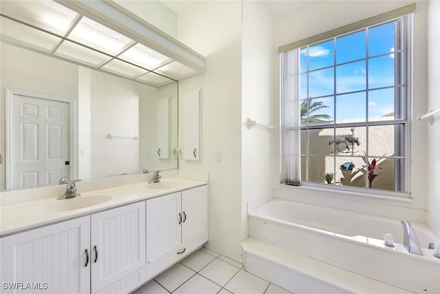 bathroom with vanity, a tub to relax in, and tile patterned floors