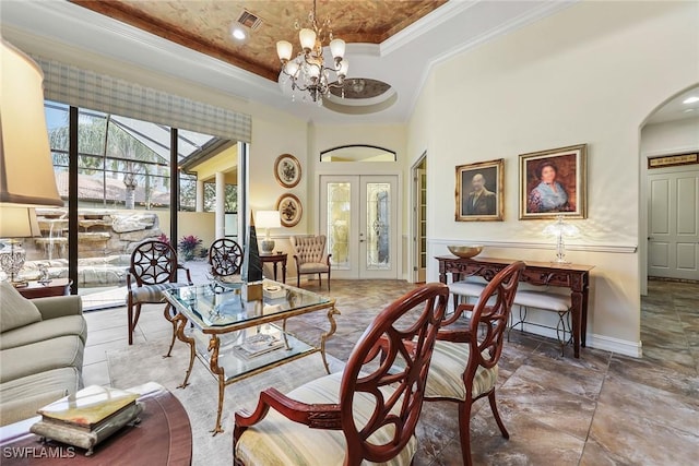 living room with french doors, an inviting chandelier, crown molding, and a high ceiling