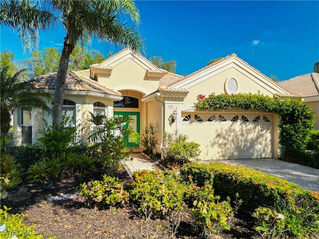 mediterranean / spanish-style home featuring a garage