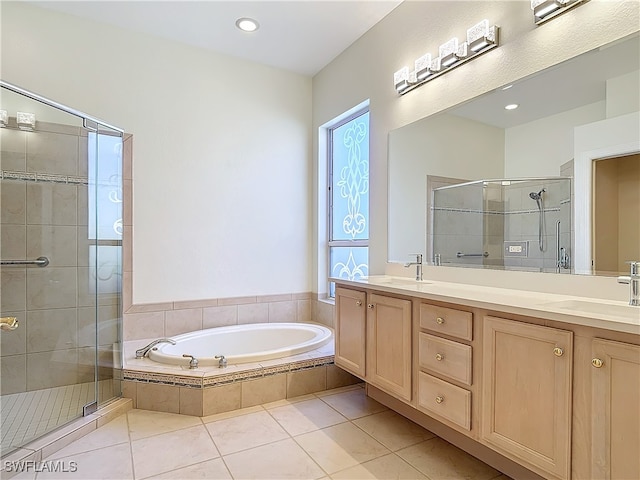 bathroom with tile patterned floors, vanity, and independent shower and bath