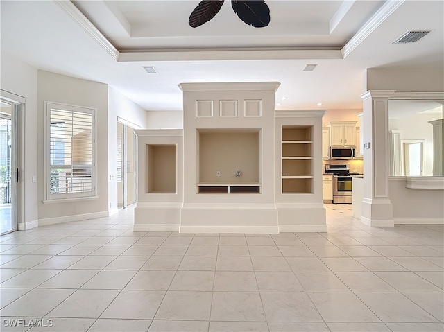 unfurnished living room with ornamental molding, built in shelves, a raised ceiling, ceiling fan, and light tile patterned floors