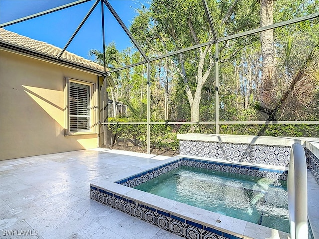 view of swimming pool with an in ground hot tub and a patio