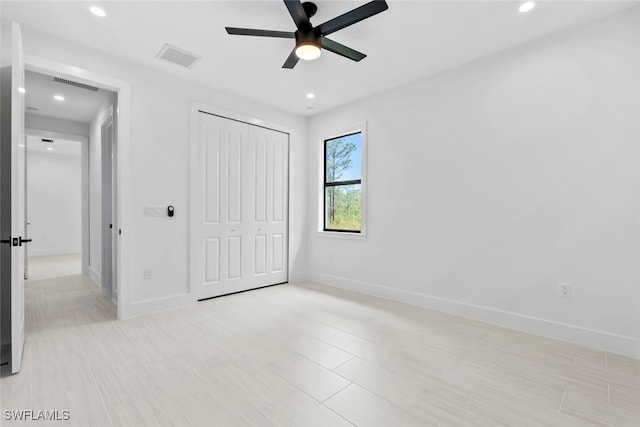 unfurnished bedroom featuring a closet and ceiling fan