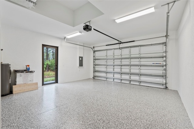 garage featuring a garage door opener and water heater