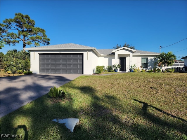 single story home featuring a front yard and a garage