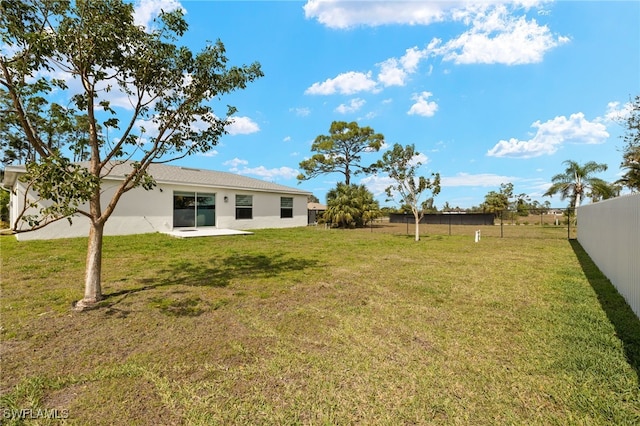 view of yard featuring a patio area and a fenced backyard