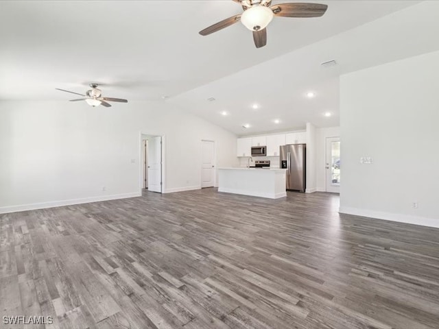 unfurnished living room featuring ceiling fan, hardwood / wood-style floors, and vaulted ceiling