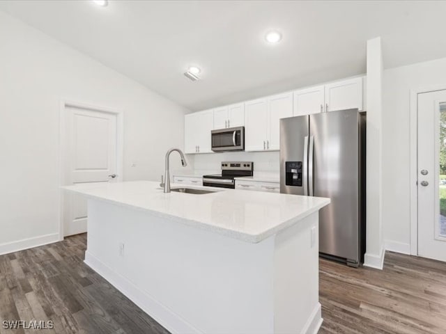 kitchen featuring appliances with stainless steel finishes, a center island with sink, white cabinetry, and dark hardwood / wood-style floors