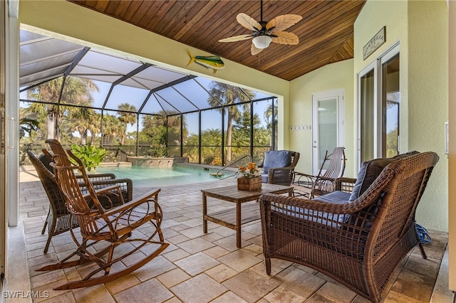 view of patio / terrace featuring ceiling fan and a lanai