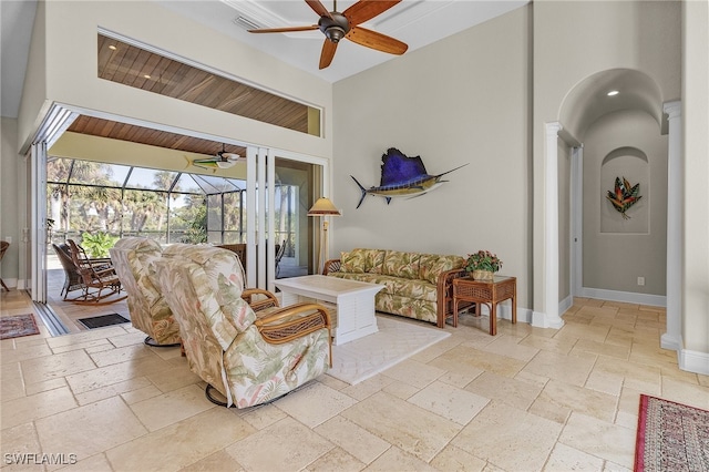 living room with ceiling fan, high vaulted ceiling, and wood ceiling