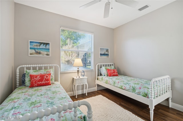 bedroom featuring ceiling fan and dark wood-type flooring