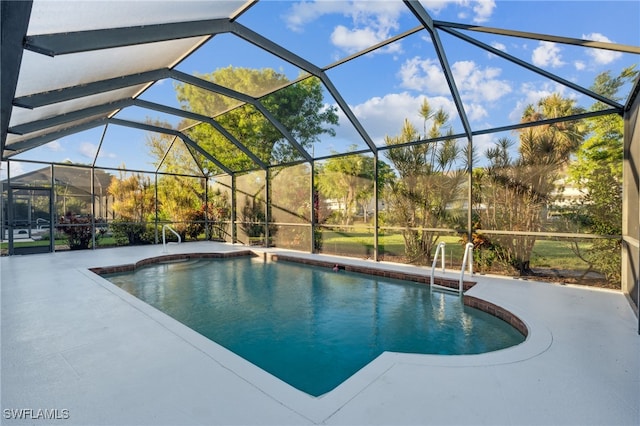 view of swimming pool with a lanai and a patio area