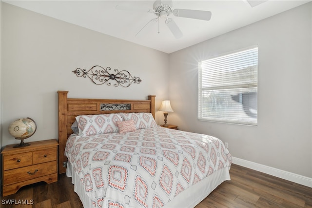 bedroom with ceiling fan and dark hardwood / wood-style flooring