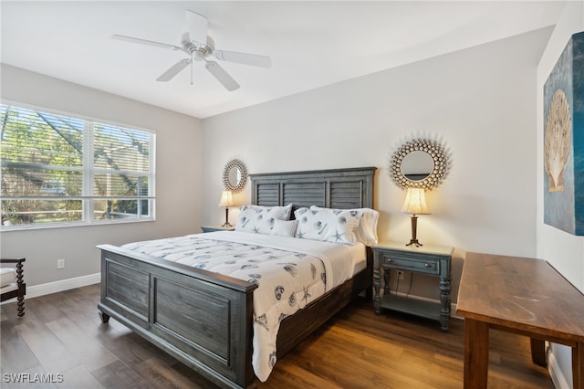 bedroom with ceiling fan and dark hardwood / wood-style flooring