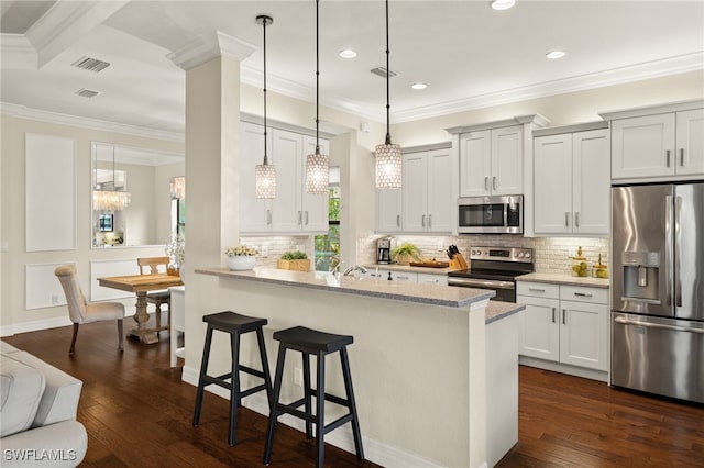 kitchen with white cabinetry, dark wood-type flooring, stainless steel appliances, light stone counters, and a kitchen bar