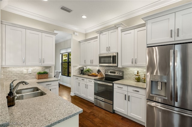 kitchen with sink, white cabinets, and stainless steel appliances