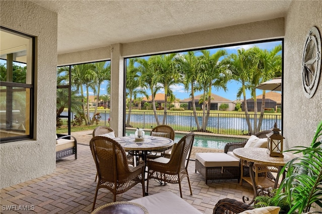 sunroom with a water view