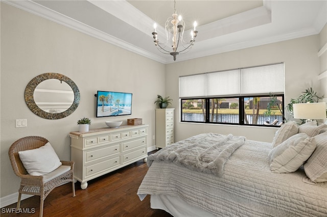 bedroom with a raised ceiling, crown molding, dark wood-type flooring, and an inviting chandelier