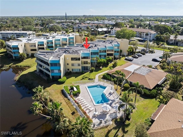 birds eye view of property with a water view