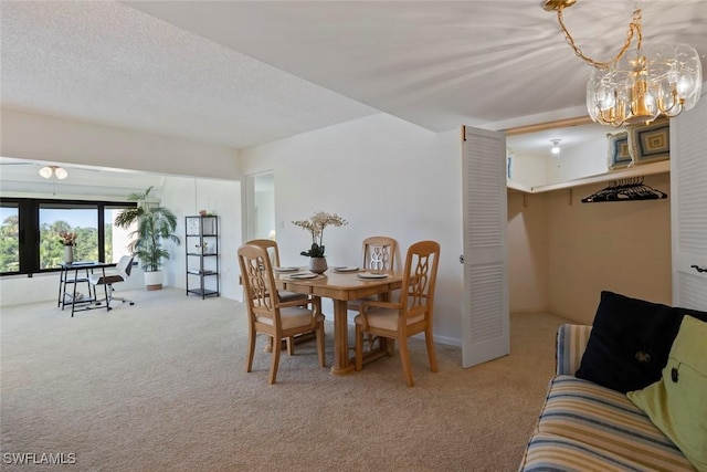 carpeted dining area with a textured ceiling and a notable chandelier