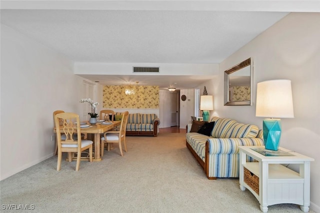carpeted living room with baseboards and visible vents