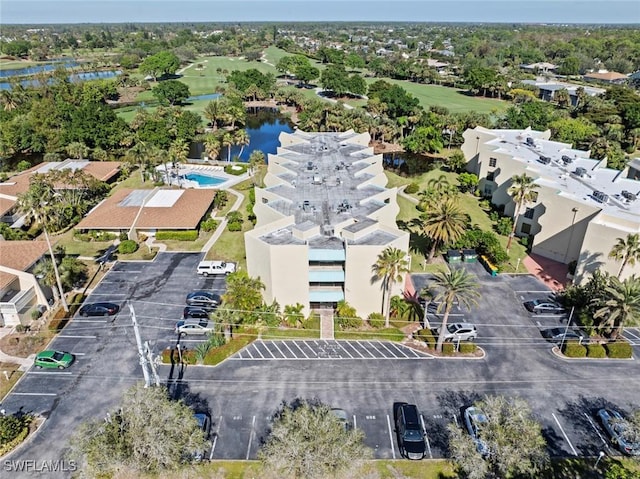 aerial view featuring a water view and golf course view