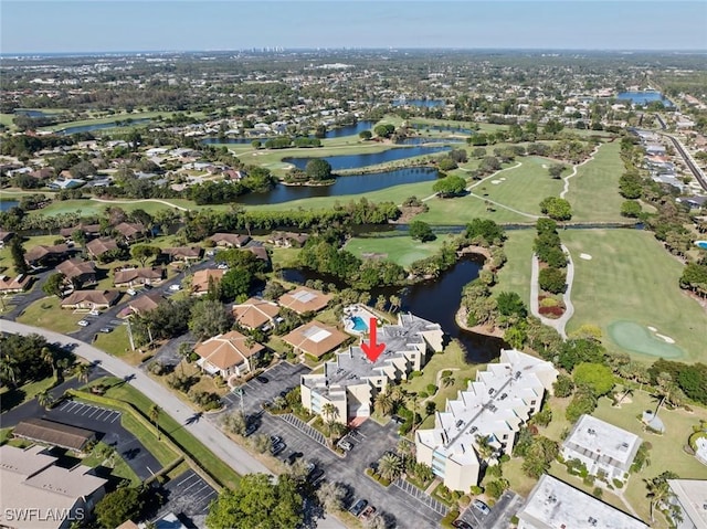 birds eye view of property featuring a water view, golf course view, and a residential view