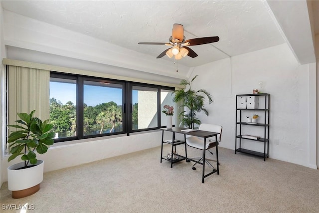 office space with light carpet and ceiling fan