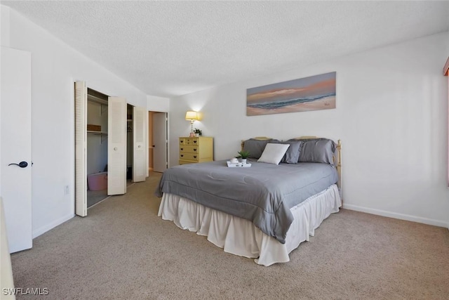 carpeted bedroom featuring a textured ceiling