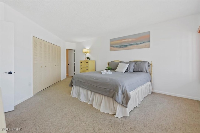 carpeted bedroom with a closet