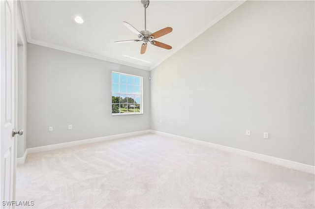 unfurnished room featuring ceiling fan, light colored carpet, crown molding, and vaulted ceiling