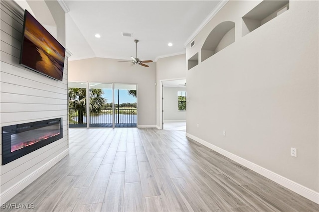 unfurnished living room featuring ceiling fan, light hardwood / wood-style flooring, high vaulted ceiling, and crown molding