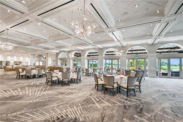 dining space with coffered ceiling, a towering ceiling, a notable chandelier, beam ceiling, and carpet floors