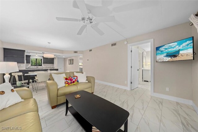 living room with ceiling fan