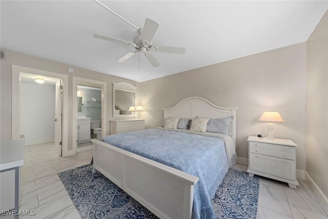 bedroom with ensuite bathroom and ceiling fan