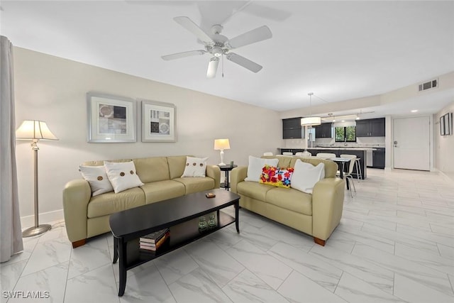 living room with ceiling fan