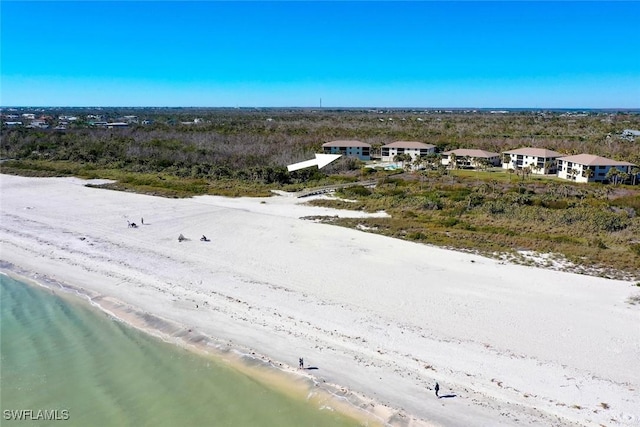 bird's eye view featuring a beach view and a water view