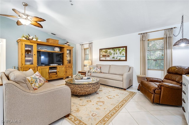 living room with light tile patterned floors, ceiling fan, and lofted ceiling